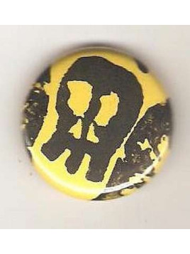 Badge jaune linogravure crâne allongé