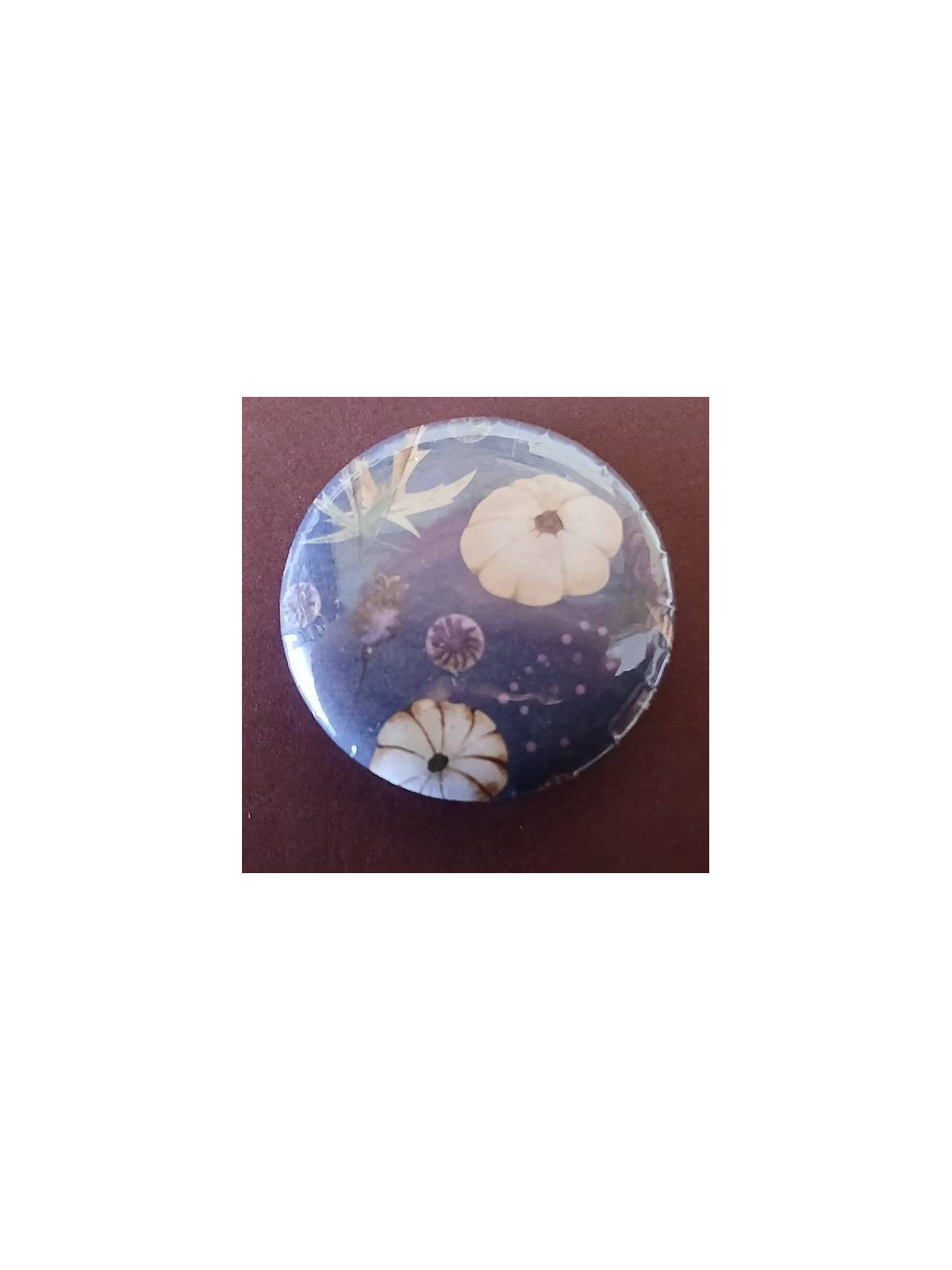 Badge Citrouille sur fond bleu