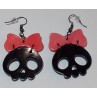 La paire de boucle d'oreilles  cranes noirs et noeuds en résine est disponible à Ciel rouge Dijon
