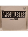 Le disque de Les spécialistes : Qui est disponible en vinyle à Ciel rouge, disquaire à Dijon