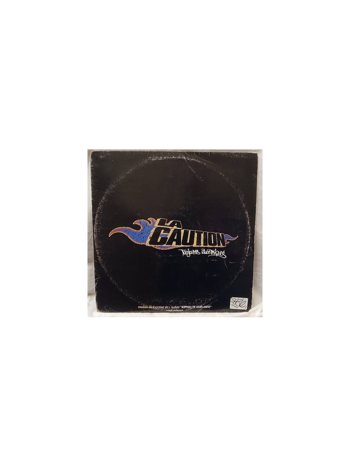Le disque deLa caution : Toujours électriques est en stock en vinyle à ciel rouge, disquaire à Dijon