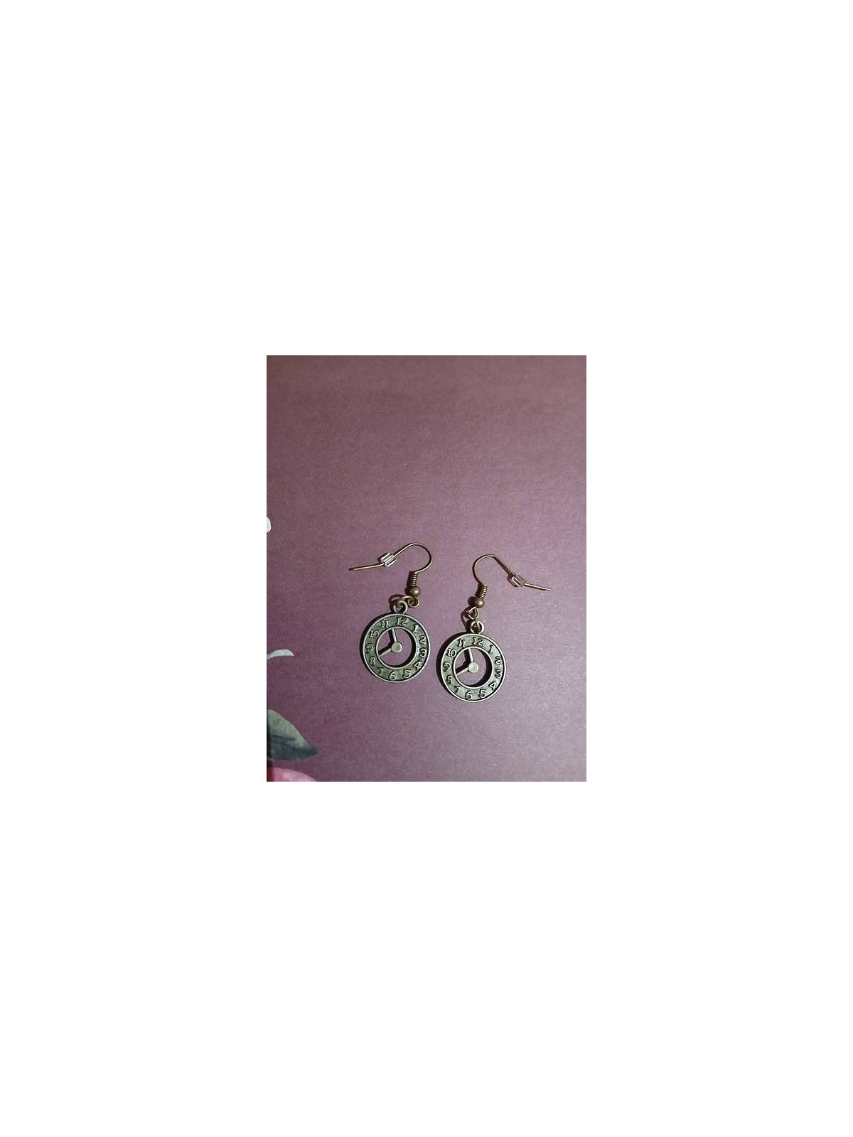 La paire de boucle d'oreille Horloges est disponible à Ciel rouge Dijon
